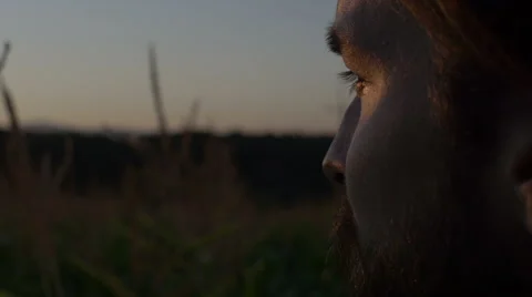 Close up of handsome man with beard looking at sunset/sunrise. 動画素材 54231793