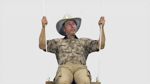 Close-up handsome middle aged man in camouflage swinging on beach swing, alpha Stock-Footage 306095879