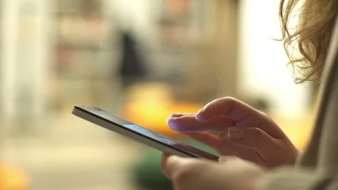 Close up of a handsome woman using typing on a smart phone cellphone Stock Footage 74130144