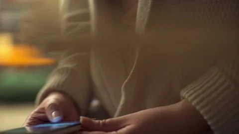 Close up of handsome woman using typing on a smart phone cellphone. Slow motion Stock Footage 74739622