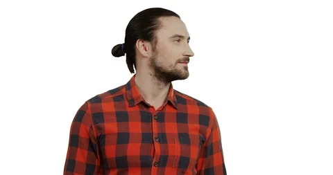 Close up of the handsome young man in the red motley shirt turning his head and Stock Footage 104171873