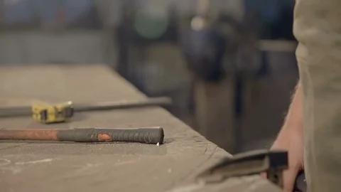 Close-up of a handsome young man in a working apron with a super gesture Stock Footage 77006151