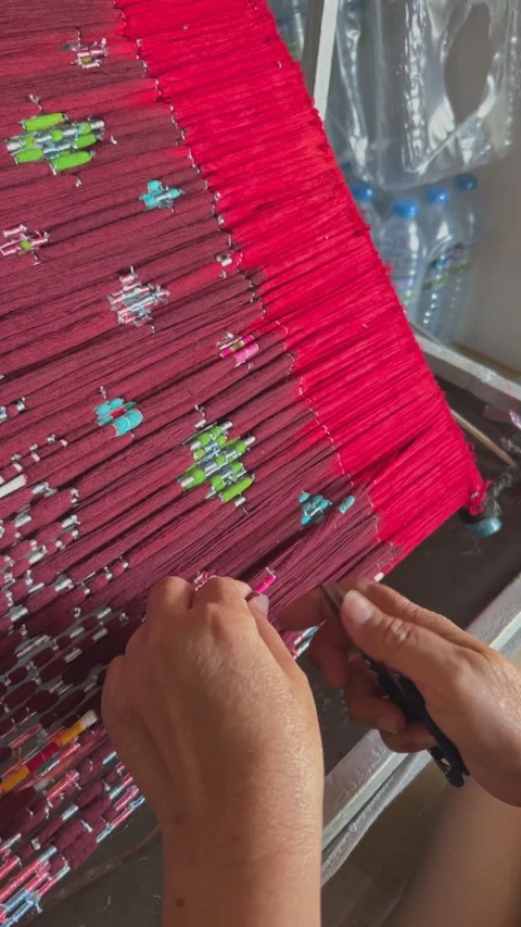 Close Up of Handwoven Ikat Silk Threads with Intricate Thai Pattern Stock Footage 331663533