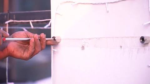 Close-up of Handyman Working on Wall Fitting Stock Footage 315787356