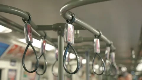 Close up of hanging grey strap handrails inside the metro train. Passenger Stock Footage 255050080