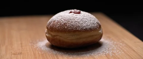 Close up of hanukkah doughnut covered in sugar powder Stock Footage 124662632
