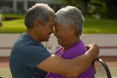 Close-up of happy biracial senior couple with eyes closed and face to face Stock Photos