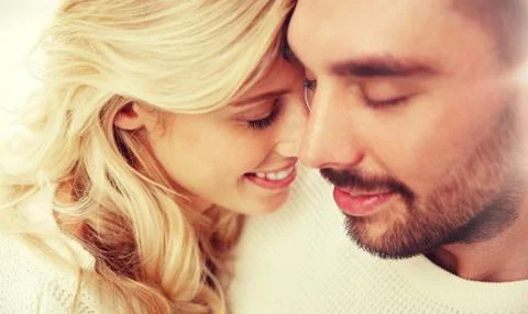 Close up of happy couple faces with closed eyes Foto stock