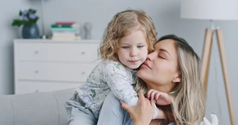 Close up of happy cute affectionate adopted little kid girl hugging foster care Stock Footage 132319771