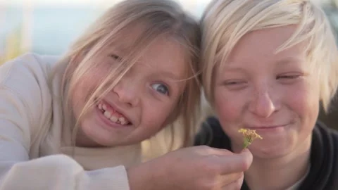 Close-up of happy faces of blond children, boy and girl. Stock Footage 260795358