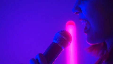 Close-up Happy feeling Attractive singer woman singing music on stage. Stock Footage 241983144
