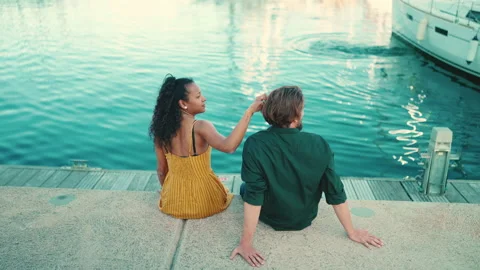 Close-up of happy interracial couple sitting in the port Video stock 226879046