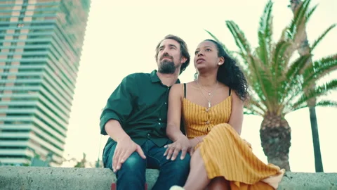 Close-up of happy interracial couple sitting in the port Vídeo Stock 226880313