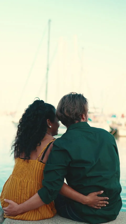 Close-up of happy interracial couple sitting in the port Stock Footage 227005667