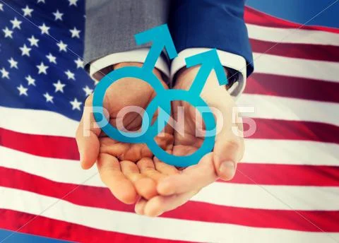 Close up of happy male gay couple with love symbol Stock Photos