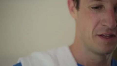 Close-up of happy man exercising at home Stock Footage