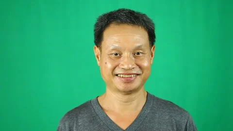 Close up happy  man with green background Stock Footage 139742040