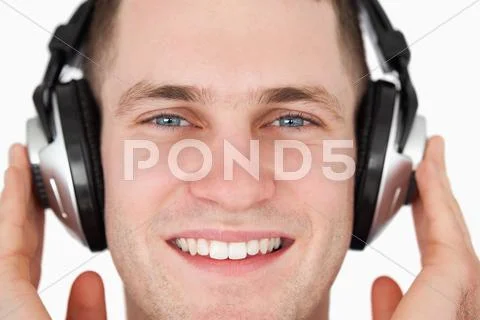 Close up of a happy man listening to music Stock Photos