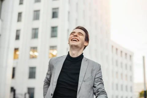 Close up of happy man smiling while going to or from work. Stock Photos