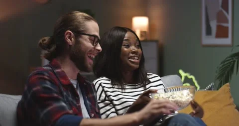 Close up of happy mixed-races handsome husband and young wife resting sitting at 스톡 동영상 147414764