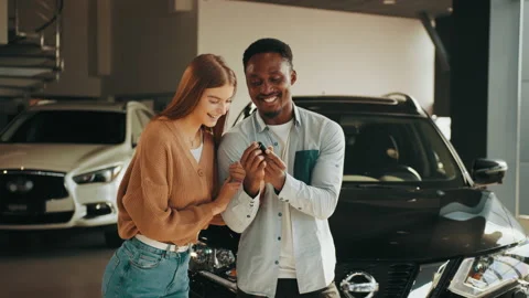 Close up of happy multicultural couple posing at modern dealership center with Stock Footage 174713204