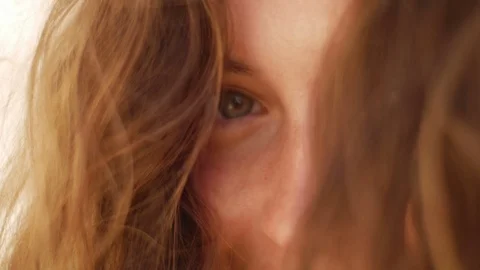 Close up of happy smiling beautiful young woman eyes and hair 스톡 동영상 74229504
