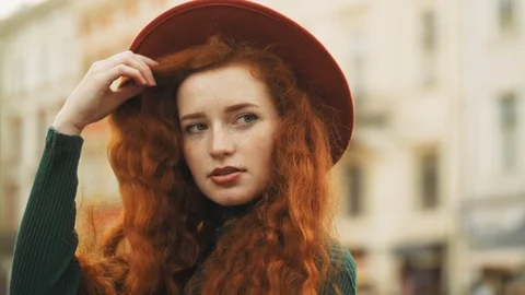 Close up of happy smiling redhead lady with natural freckles, long curly hair Stock Footage 106510162