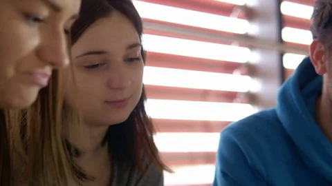 Close-up of happy students learning and writing in the notebook Stock Footage 75555930