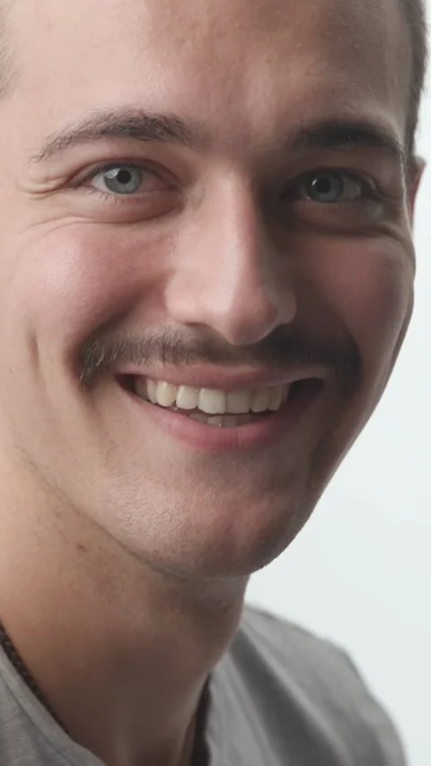 Close-up of Happy Young Man Turning and Laughing at Camera on White Backgroun Stock Footage 341659458