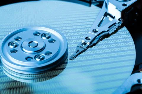 Close up of hard disk with binary language reflection on surface Stock Photos