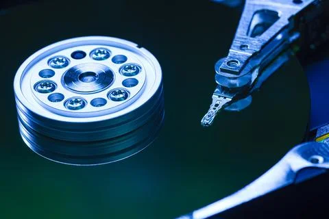 Close-up of hard disk drive reading data with blue light 스톡 사진