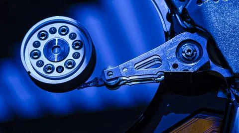 Close-up of hard disk drive reading data with blue light 스톡 사진