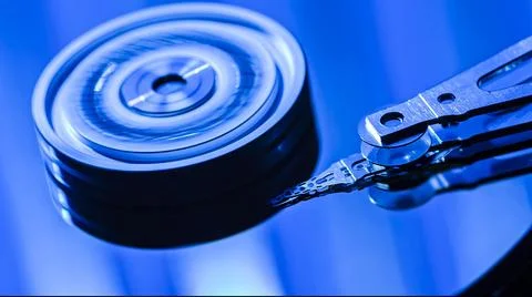 Close-up of hard disk drive reading data with blue light 스톡 사진