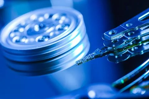 Close-up of hard disk drive reading data in blue light 스톡 사진