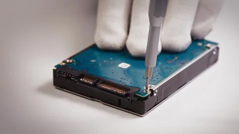 Close-up of hard drive being disassembled by skilled technician in white gloves Stock Footage 315448155
