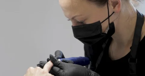Close-up of hardware manicure with electric machine removes the nail polish. Stock Footage 115050662
