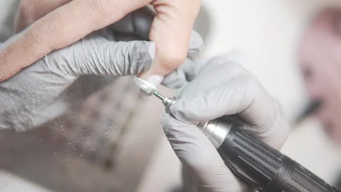 Close-up of hardware manicure of womens nails Stock Footage 309626330