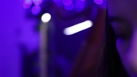 Close-up of Harp Strings and Person in Dreamy Purple Room with Soft Lighting Stock Footage 338024769