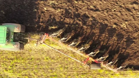 Close-up of a harrow plowing a field. Video stock 148038749