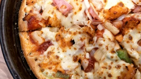 Close-up of Hawayein Pizza on the table. Stock Footage 114555299