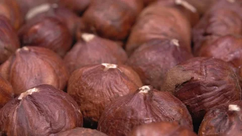 A close-up of hazelnuts. Whole nut kernels. Hazelnut macro. Видео 142791055