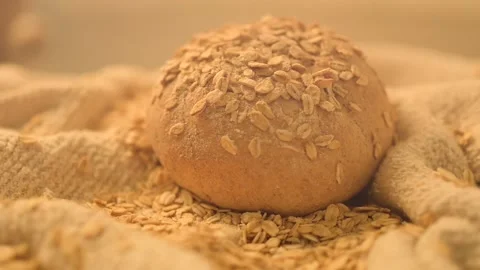 Close-up hd slow motion video of homemade bread on a rustic background. Fresh Ba Stock Footage 134062909