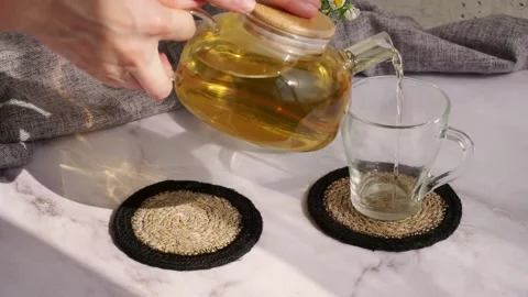 Close-up HD video a woman's hand pours herbal tea Stock Footage 204740024