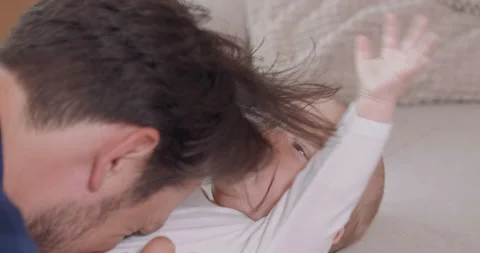 Close up of the head of bearded and mustashed father, who is kneeling by the Stock Footage 140173176