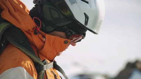 Close-up of the head of a climber who is preparing equipment to climb the Stock Footage 105802192