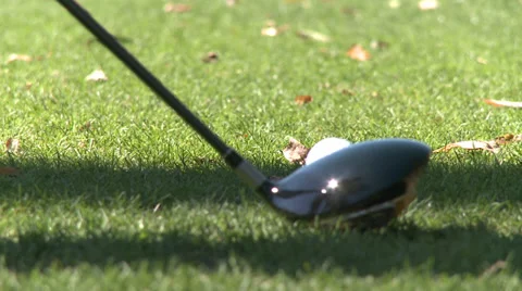 Close up of head of driver hitting ball off tee (1 of 2) Stock-Footage 32035686
