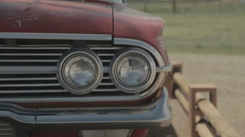 Close up on head lights of abandoned car in Desert Stock Footage 65055985