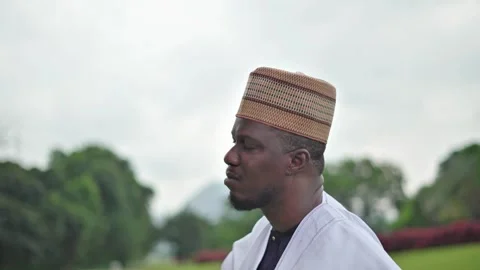 Close up head-shot of African man as he removes his glasses and stares upwards. 스톡 동영상 283985196