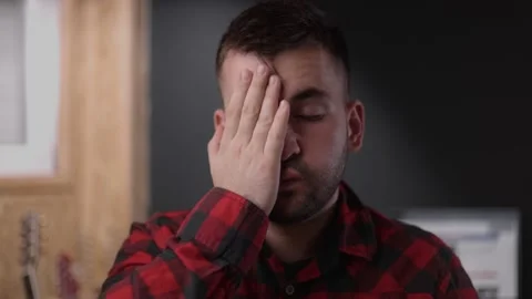 Close up head shot depressed young caucasian man Stock Footage 163703395