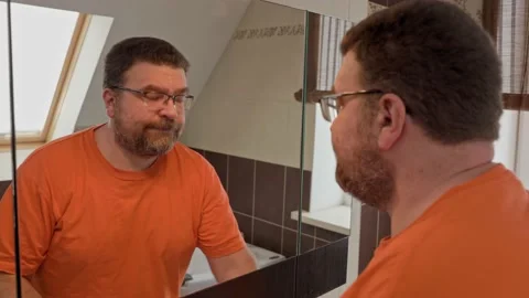 Close up head shot mirror reflection man brushing teeth with toothpaste. Stock Footage 167258316